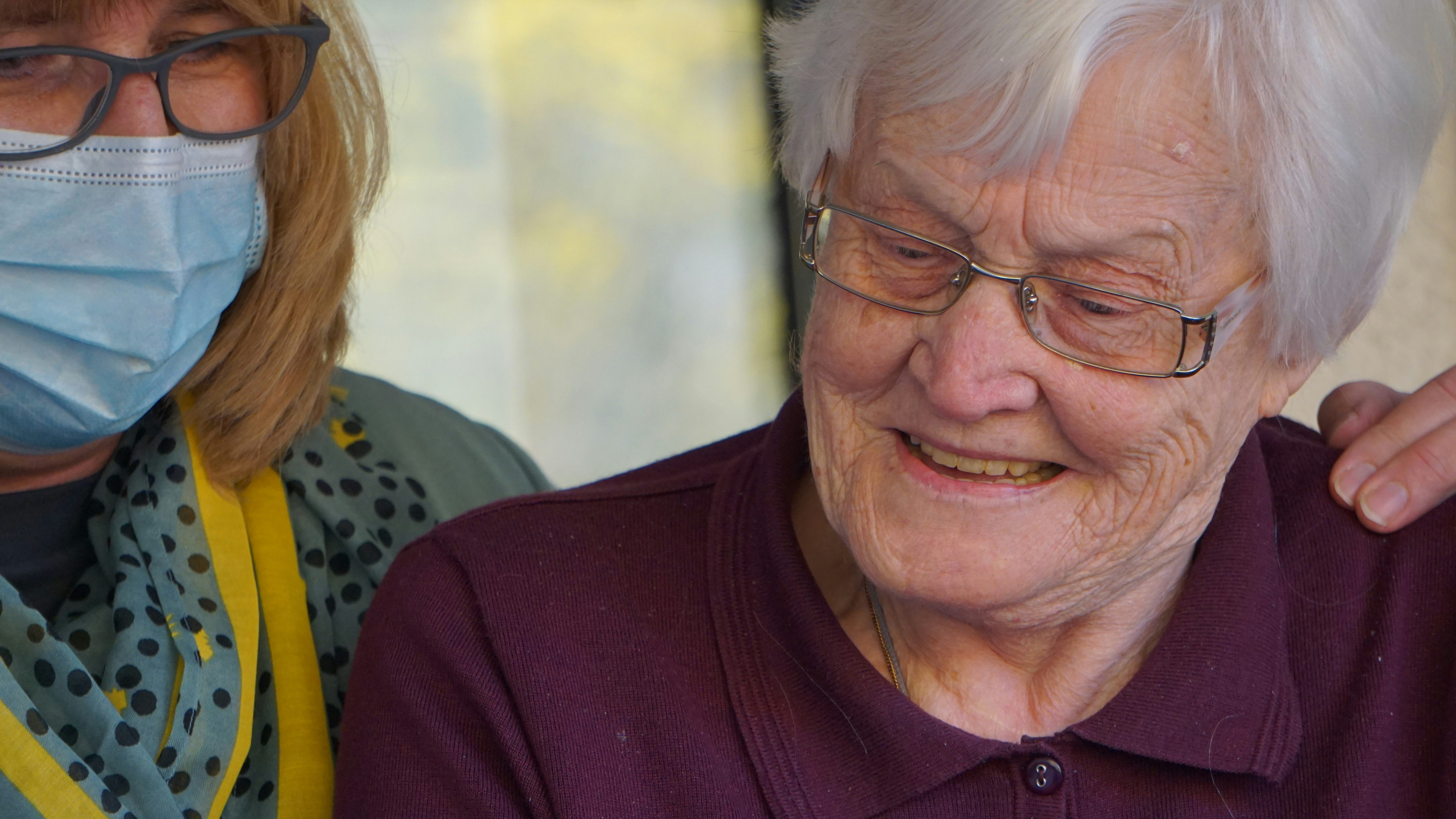Carer and patient looking at a screen.
