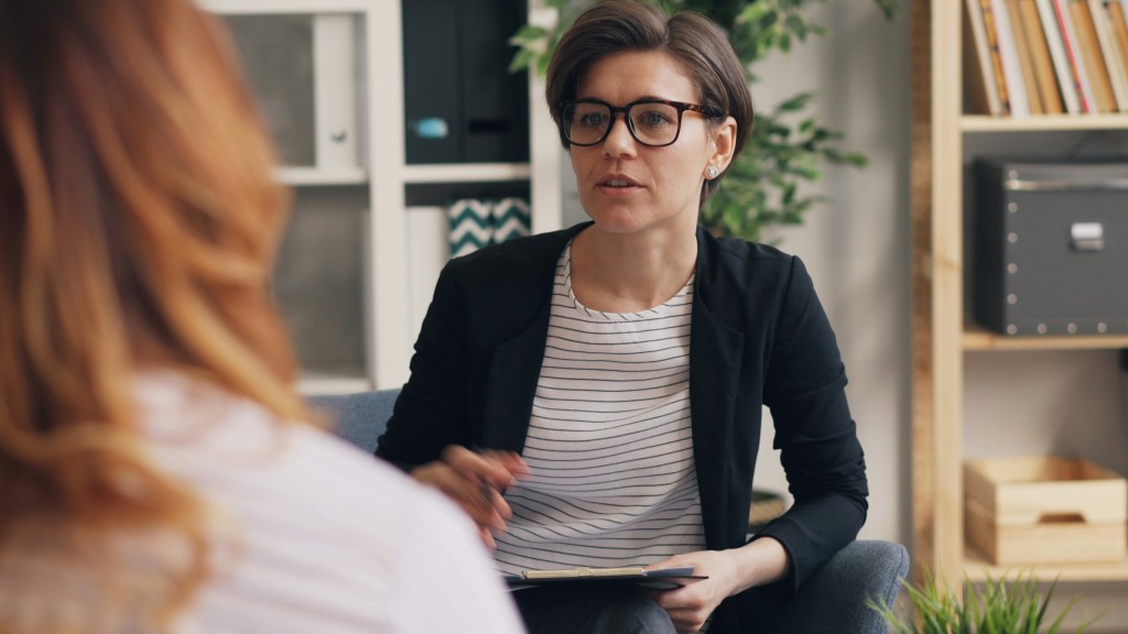Female therapist conducting a session.